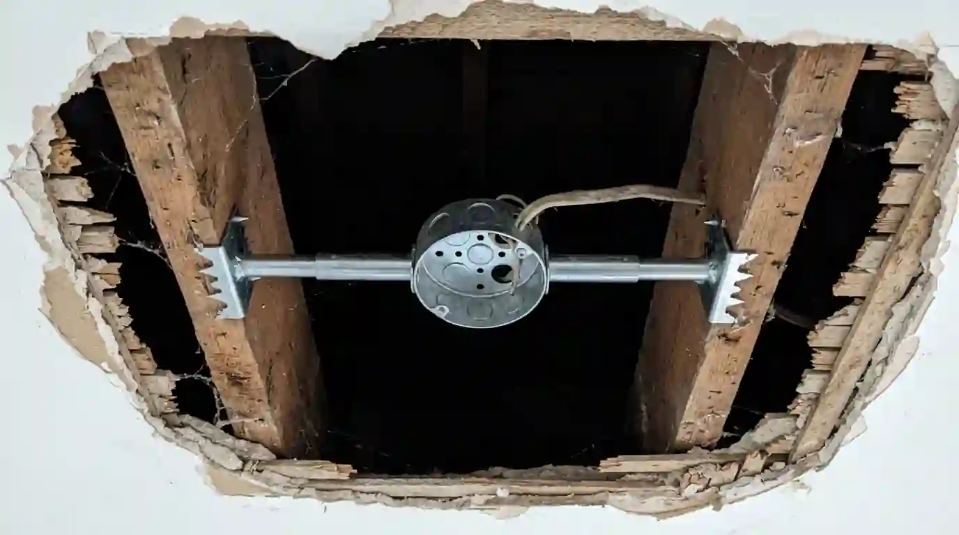 Fan brace and rated box installed between joists
