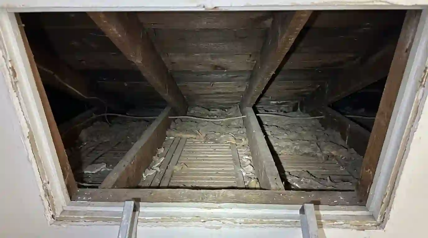 Shallow roof cavity above a rowhome top floor ceiling